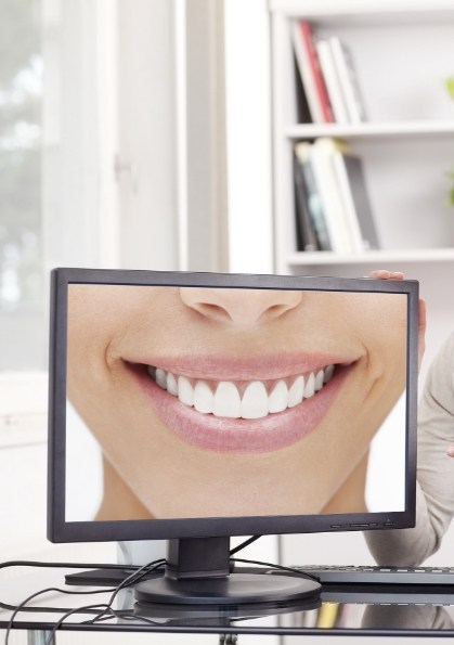 Computer screen showing close up of smile with flawless teeth
