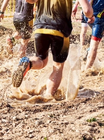 People running through mud