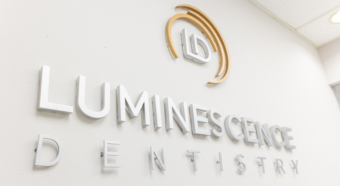 Luminescence Dentistry sign on white wall